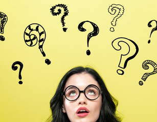 Question Marks with young woman on a yellow background