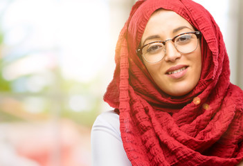 Young arab woman wearing hijab confident and happy with a big natural smile laughing, natural expression