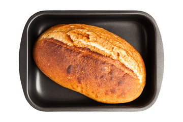Baking sheet with freshly baked crunchy French loaf isolated on white background