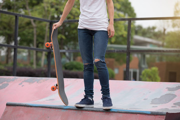 Skateboarder sakteboarding on skatepark ramp © lzf
