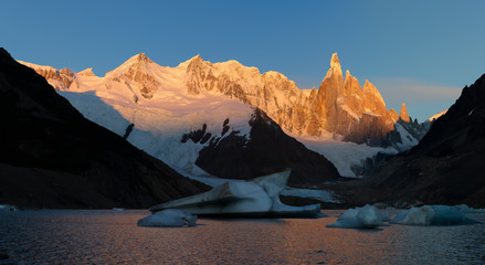Alpenglow warm morning light touch the Cerro Torre, the mountains in the Southern Patagonian Ice...