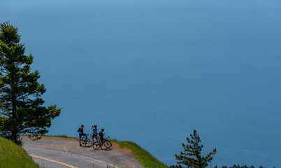 Bike riders stop to check phones 