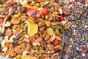 Healthy food background. Sweet energy  dry fruits and nuts mix, herbal tea. Selective focus.