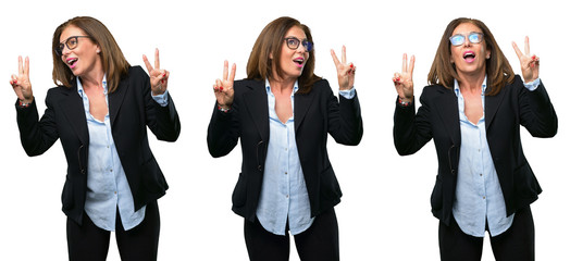 Middle age business woman happy and excited expressing winning gesture. Successful and celebrating victory, triumphant over white background