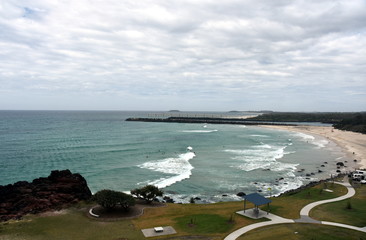 Duranbah beach and breakwall at the entrance of Tweed River on a cloudy day. Duranbah Beach, officially known as Flagstaff beach is the most northern beach in New South Wales.