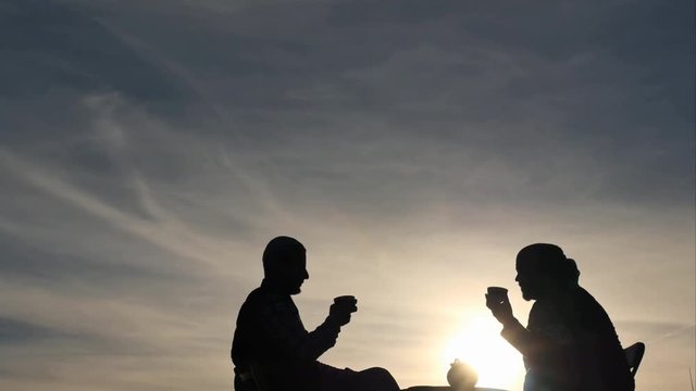 friendly People drinking rea silhouettes vertical dolly shot