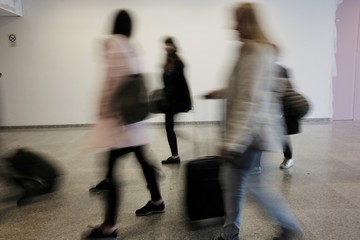 blurry people at the airport
