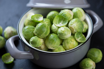 Close-up of fresh uncooked brussels sprouts in a pot, selective focus, horizontal shot