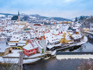 Panoramic view of Cesky Krumlov in winter season, Czech Republic. View of the snow-covered roofs....