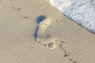 trace from a bare foot in the sand
