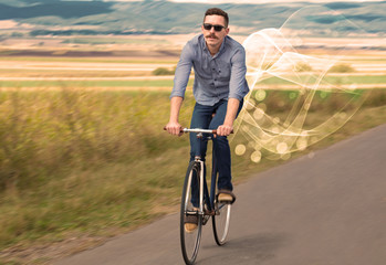 Gorgeous biker in the nature going somewhere with ethereal concept