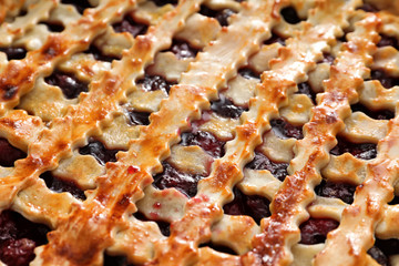 Delicious cherry pie with lattice top, closeup