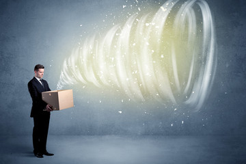 An illustrated powerful whirlwind escaping, coming out of empty paper box held by elegant...