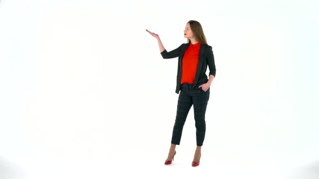 Womanl in the studio on a white background shows gestures. Copyspace for text