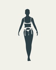 Beautiful sexy fitness girl. Pretty woman wearing lingerie. Back view.