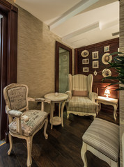 Comfortable ancient armcairs and table in restaurant