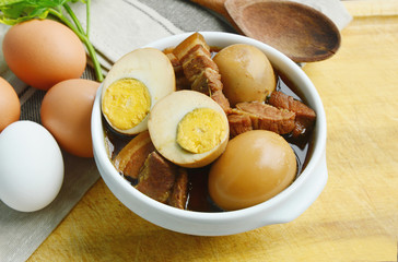 Thai Egg Menu.
Eggs Stewed or Thai name is khai phalo muu saam chan on wooden background