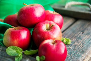 group of red apples on wooden natural background, fresh natural food and vitamins concept in rustic style