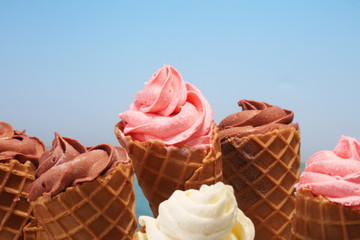 Vanilla frozen yogurt or soft ice cream in waffle cone.