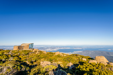 Stunning view from highest mountain peak to Hobart city blue sea ocean bay harbour and stones rocks...