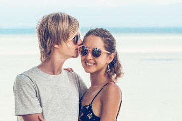 Portrait of happy couple on the beach