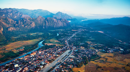 Aerial view of a small town in rocky mountain valley and river