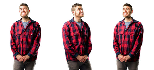 Young man confident and happy with a big natural smile laughing looking up isolated over white background, collage composition