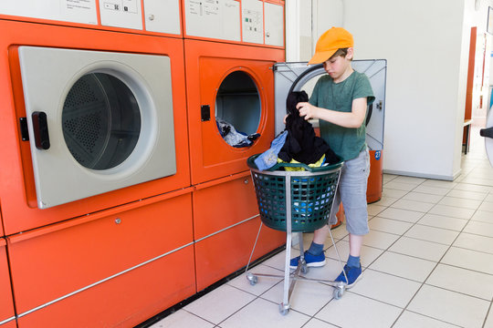 Doing The Laundry In A Laundromat Salon