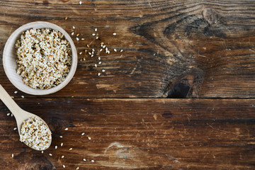 white sesame seed, sesame seed in wooden Cup on natural wooden background in rustic style