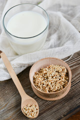 sesame milk sesame seed in a glass on wooden background, concept of healthy eating, organic food, gluten-free and aslacton vegetable milk.