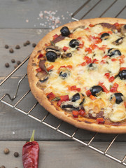 homemade pizza on a wooden table. 