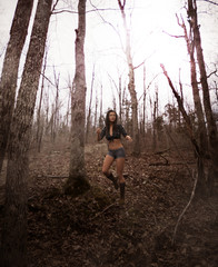 3d illustration of woman lost in the woods,there is something following her in the forest,Scary background mixed media for book cover,book illustration