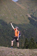 Obraz premium Image of man photographing telephone background of mountain