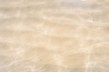 Amazing view to small paradise like island sandy beach with turquoise blue water and green shore jungle forest on warm sunny clear sky day camping ground, Jetty Beach Bruny Island, Tasmania, Australia