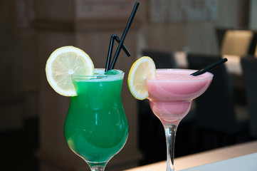 Glasses with cocktails on the background of the bar