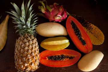 papaya, mango, lychee, pineapple lie on a plate