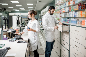 Pharmacists working in the pharmacy store