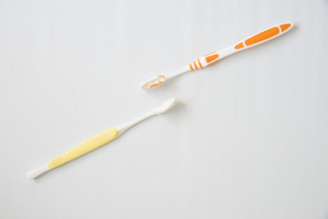Toothbrush with toothpaste on white background.
