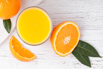 Glass of organic fresh orange juice with fruits