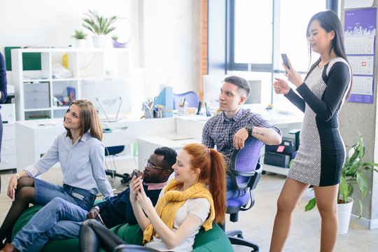multi ethnic friends are gathered in the training centure with panorama window and loft interior