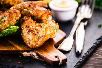 Roast chicken wings with baked potatoes