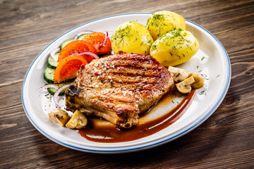 Grilled beefsteak with boiled potatoes and vegetables