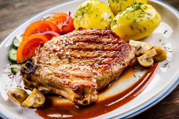 Grilled beefsteak with boiled potatoes and vegetables