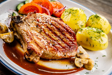Grilled beefsteak with boiled potatoes and vegetables