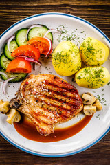 Grilled beefsteak with boiled potatoes and vegetables