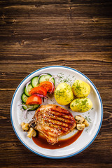 Grilled beefsteak with boiled potatoes and vegetables