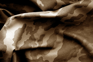 Military uniform pattern in blrown tone.