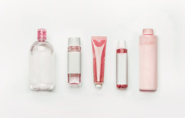 Pink natural cosmetic products : gel, lotion, serum, micellar water and toner,   bottles and tubes...