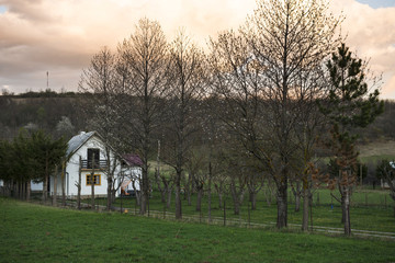 Village house in a field at sunset. Plitvice lakes, Croatia UNESCO world heritage site