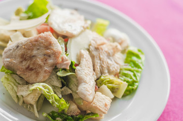 Cesar salad with roasted chicken meat